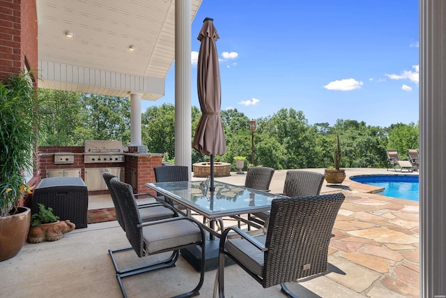 view of patio / terrace with outdoor dining area, grilling area, area for grilling, and an outdoor pool