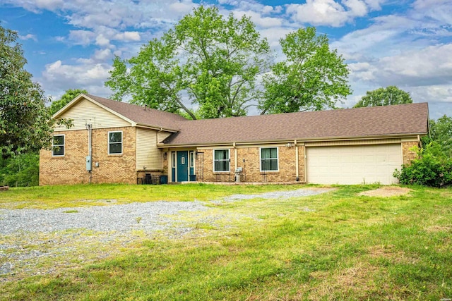 75 Grant 7, Sheridan, AR 72150 - split level home with a front yard, an attached garage, and brick siding
