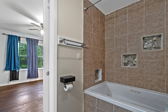 75 Grant 7, Sheridan, AR 72150 - bathroom with a ceiling fan, tiled shower / bath combo, wood finished floors, and baseboards