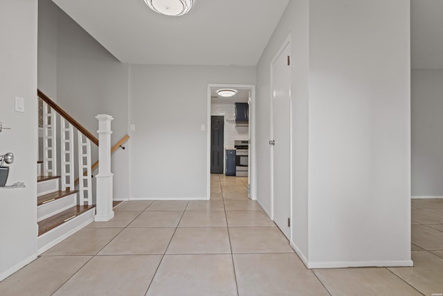 75 Grant 7, Sheridan, AR 72150 - corridor with light tile patterned floors, stairs, and baseboards