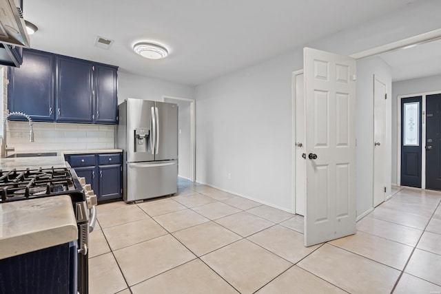 75 Grant 7, Sheridan, AR 72150 - kitchen featuring light tile patterned floors, stainless steel appliances, blue cabinets, and a sink