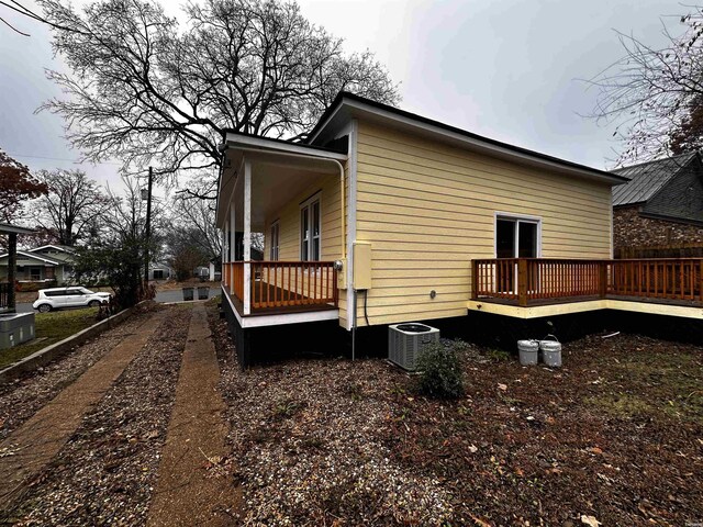 view of side of property with cooling unit