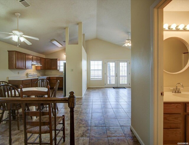 dining room featuring a ceiling fan, french doors, visible vents, and tile patterned floors