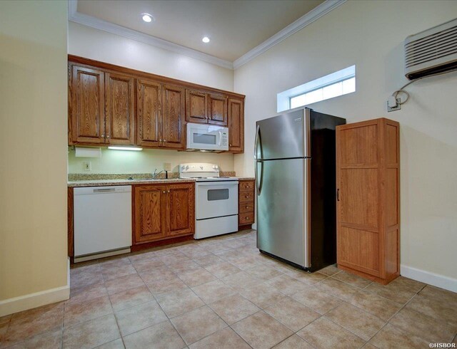 kitchen featuring white appliances, ornamental molding, brown cabinets, a wall mounted air conditioner, and light countertops