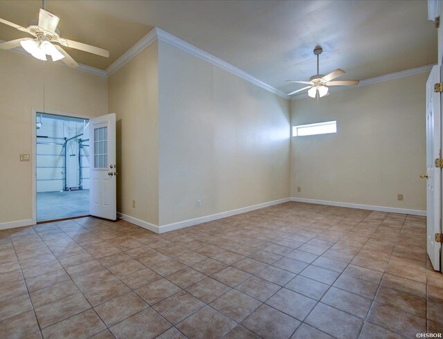 empty room with crown molding, baseboards, and ceiling fan