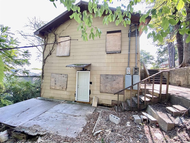 rear view of property featuring a patio