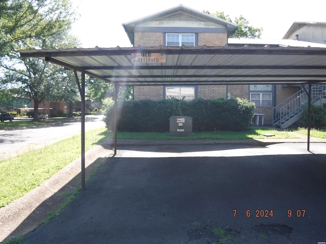 view of parking / parking lot featuring stairs