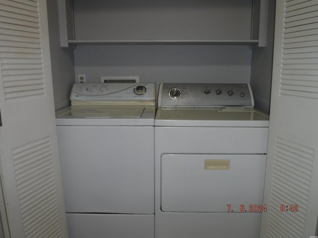 laundry area with laundry area and separate washer and dryer