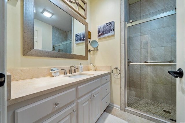 full bath featuring vanity and a shower stall