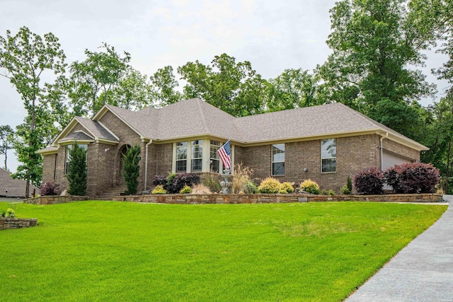 105 Osprey Dr, Hot Springs, AR 71913 - view of front of house featuring brick siding, a front lawn, an attached garage, and roof with shingles