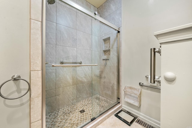 full bath with a shower stall