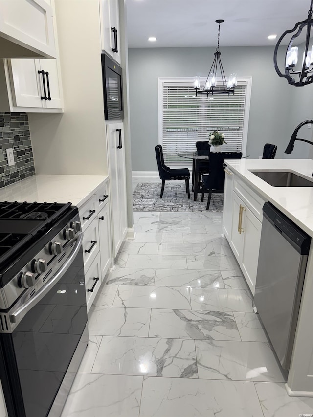 202 Quail Ridge Dr, Hot Springs, AR 71901 - kitchen featuring a chandelier, stainless steel appliances, recessed lighting, white cabinetry, and decorative light fixtures