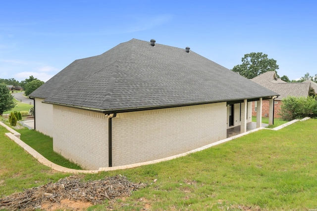 202 Quail Ridge Dr, Hot Springs, AR 71901 - view of side of home featuring a shingled roof, brick siding, and a yard