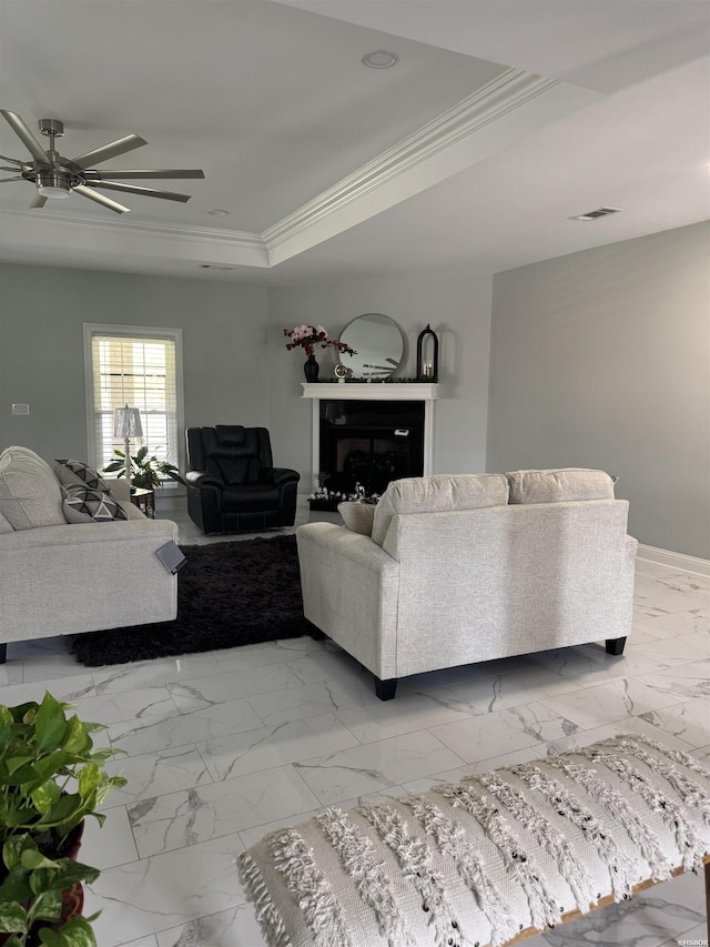 202 Quail Ridge Dr, Hot Springs, AR 71901 - living room featuring ceiling fan, marble look tiles, ornamental molding, a tray ceiling, and a fireplace