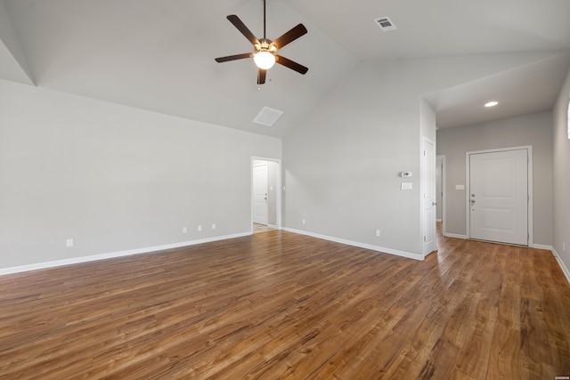 unfurnished room featuring high vaulted ceiling, wood finished floors, a ceiling fan, visible vents, and baseboards