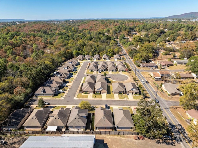 birds eye view of property featuring a residential view and a view of trees