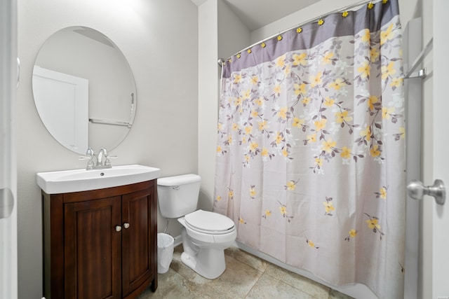 full bathroom featuring vanity, toilet, and tile patterned floors