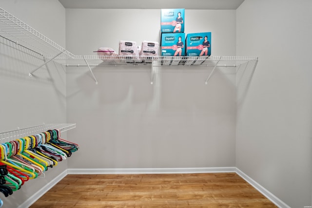 spacious closet with wood finished floors