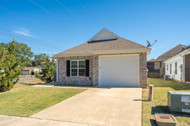 view of front of home featuring central AC unit, brick siding, driveway, roof with shingles, and a front lawn