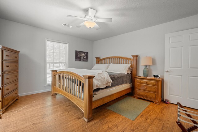 67 Delton Mccauley Rd, Kirby, AR 71950 - bedroom with light wood-style floors, a ceiling fan, and baseboards