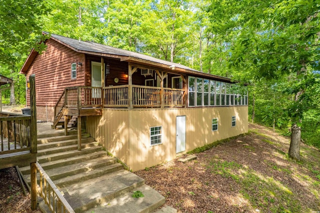 67 Delton Mccauley Rd, Kirby, AR 71950 - view of front of house with log veneer siding, stairs, and a deck