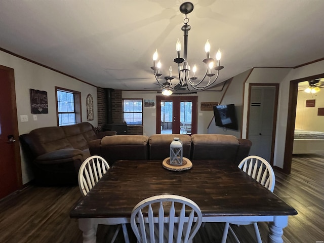 dining room featuring a chandelier, crown molding, and wood finished floors