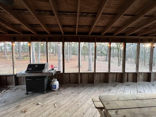 unfurnished sunroom with a wealth of natural light