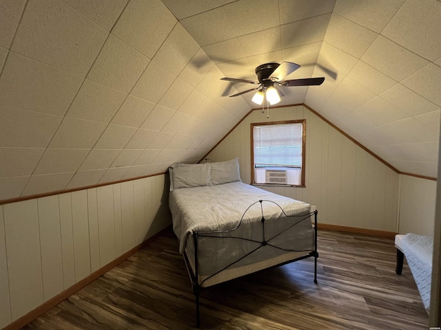 bedroom featuring vaulted ceiling, ceiling fan, dark wood-style flooring, and baseboards