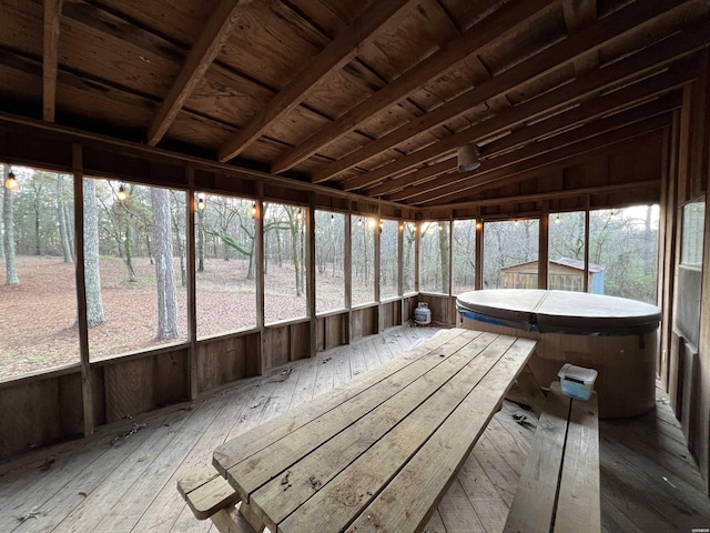 unfurnished sunroom with lofted ceiling, a sauna, and wooden ceiling