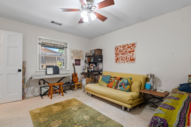 carpeted living area featuring a ceiling fan and visible vents