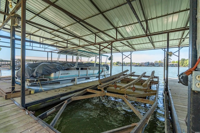 dock area featuring a water view and boat lift