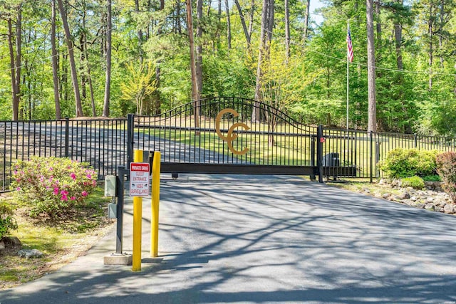 view of gate featuring fence