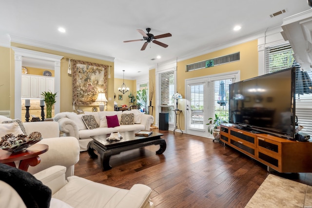 living room with recessed lighting, ceiling fan with notable chandelier, visible vents, dark wood-style floors, and crown molding