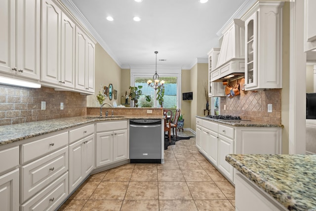 kitchen featuring hanging light fixtures, appliances with stainless steel finishes, glass insert cabinets, ornamental molding, and white cabinets