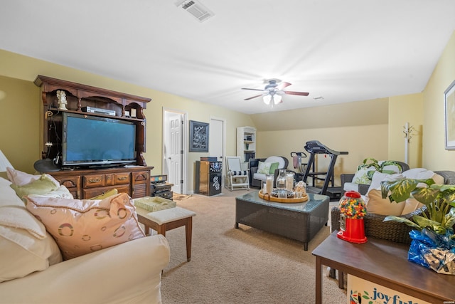 living area with light carpet, ceiling fan, and visible vents