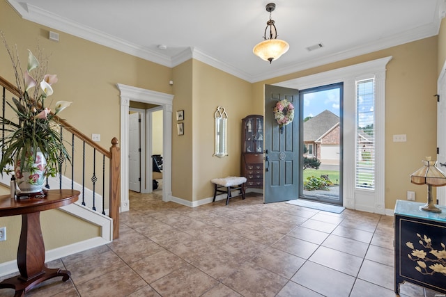 foyer entrance with ornamental molding, stairway, light tile patterned flooring, and baseboards