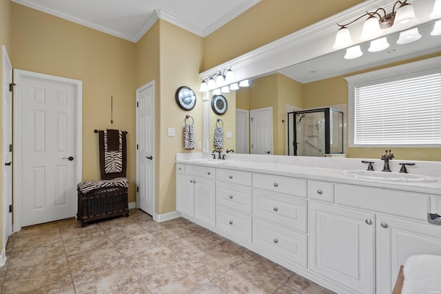 full bathroom with double vanity, a stall shower, a sink, and crown molding