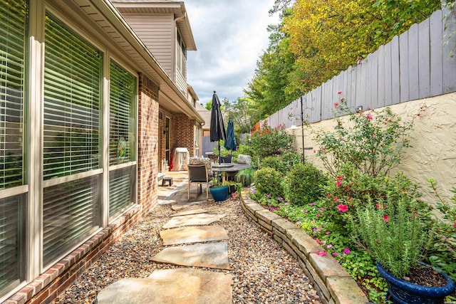 view of yard with a patio area and a fenced backyard