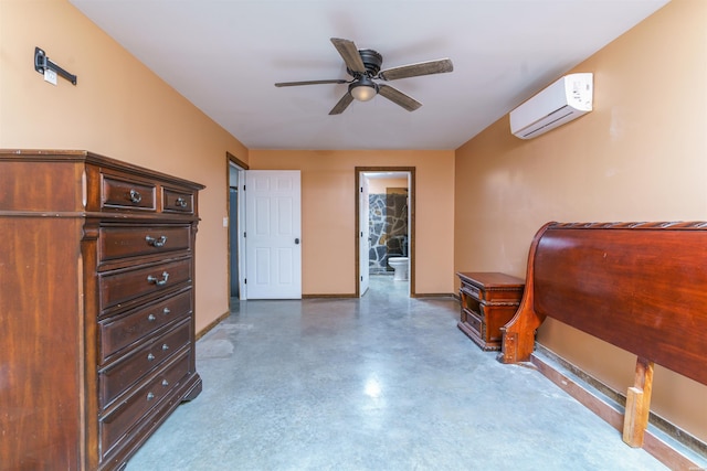 120 Needham Rd, Fountain Lake, AR 71901 - bedroom featuring a wall mounted AC, baseboards, finished concrete flooring, ensuite bathroom, and a ceiling fan