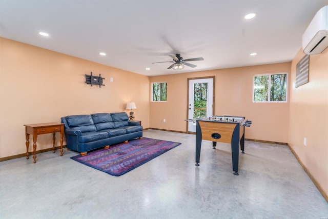 120 Needham Rd, Fountain Lake, AR 71901 - playroom featuring baseboards, a ceiling fan, concrete flooring, recessed lighting, and a wall unit AC