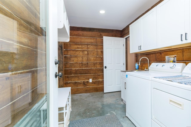 120 Needham Rd, Fountain Lake, AR 71901 - washroom with separate washer and dryer, wood walls, a sink, and cabinet space