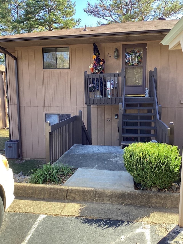 view of exterior entry featuring central AC unit