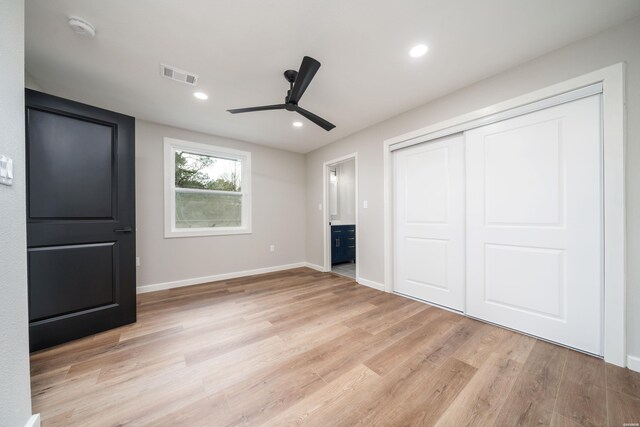 unfurnished bedroom with light wood finished floors, recessed lighting, a closet, visible vents, and baseboards