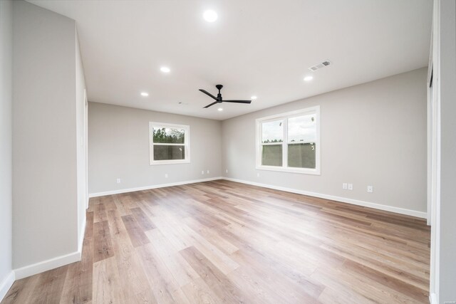 unfurnished room featuring recessed lighting, baseboards, visible vents, and light wood finished floors