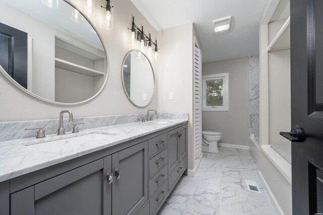 full bath featuring toilet, marble finish floor, a sink, and visible vents