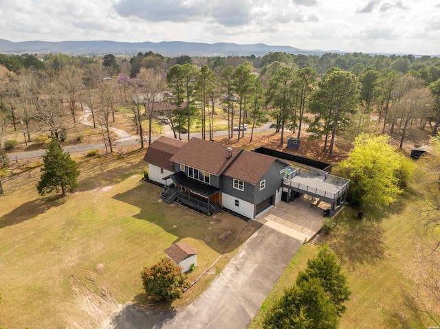 birds eye view of property with a mountain view