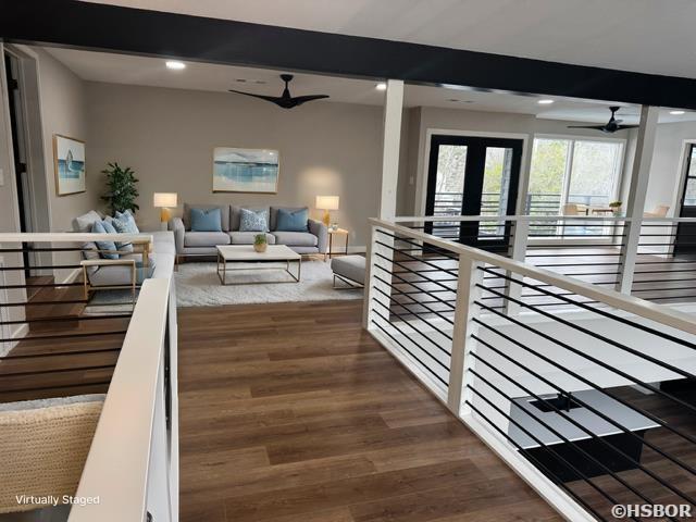 interior space with dark wood-style floors, recessed lighting, beam ceiling, and a ceiling fan