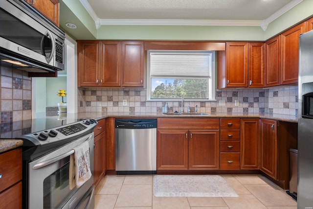 310 Kleinshore Rd Unit C9, Hot Springs, AR 71913 - kitchen featuring stainless steel appliances, ornamental molding, brown cabinetry, light stone countertops, and backsplash