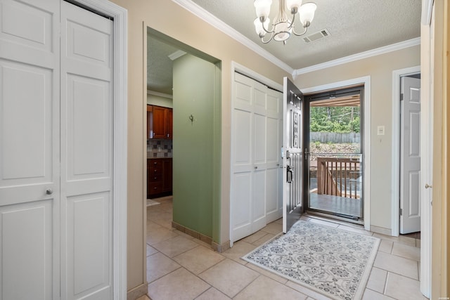 310 Kleinshore Rd Unit C9, Hot Springs, AR 71913 - foyer with a chandelier, crown molding, a textured ceiling, and light tile patterned floors
