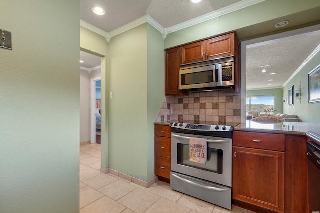 310 Kleinshore Rd Unit C9, Hot Springs, AR 71913 - kitchen with stainless steel appliances, ornamental molding, tasteful backsplash, light tile patterned floors, and recessed lighting